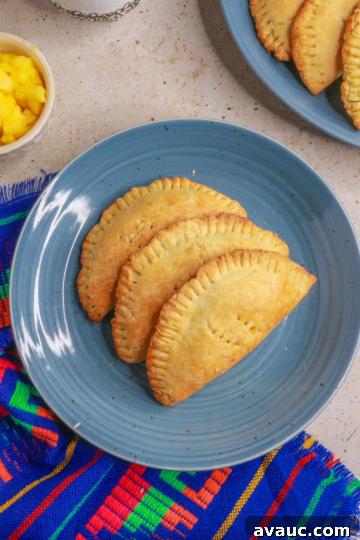 Delightful Gluten-Free Pineapple Empanadas 16 Close-up top view of Gluten-Free Empanadas de Piña, showing the golden crust and filling peeking out
