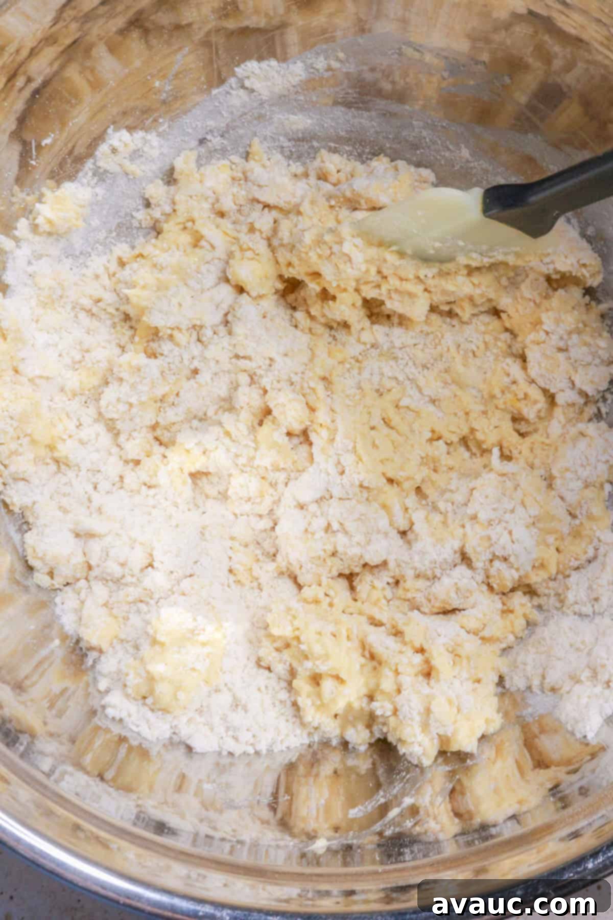 Delightful Gluten-Free Pineapple Empanadas 7 Adding wet ingredients (eggs and milk) to dry ingredients for empanada dough