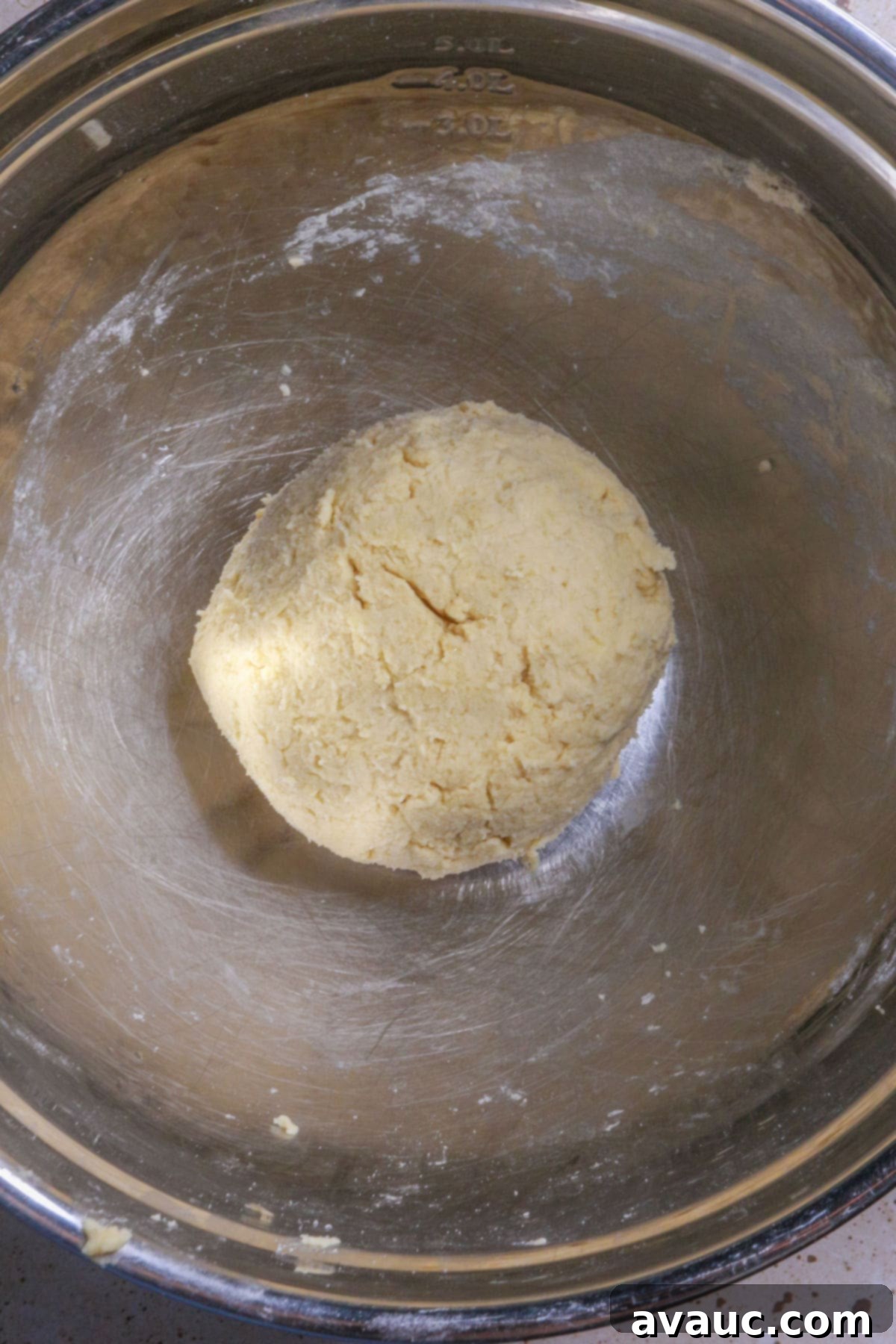 Delightful Gluten-Free Pineapple Empanadas 8 Forming dough ball for empanadas de piña and wrapping it for chilling