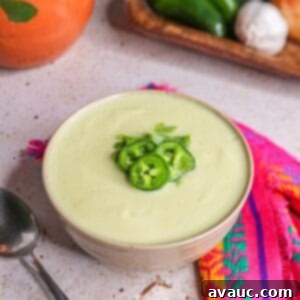 Cream of Onion Soup with Jalapeño (Crema de Cebolla), garnished with jalapeño and cilantro.