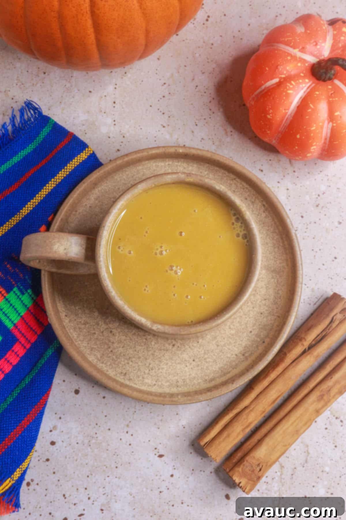 overhead view of a mug of atole de calabaza (pumpkin atole)