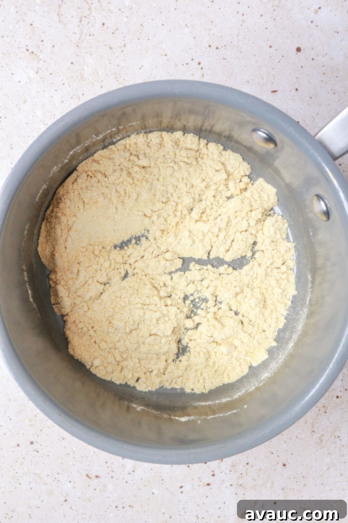 toasting masa harina in a pan