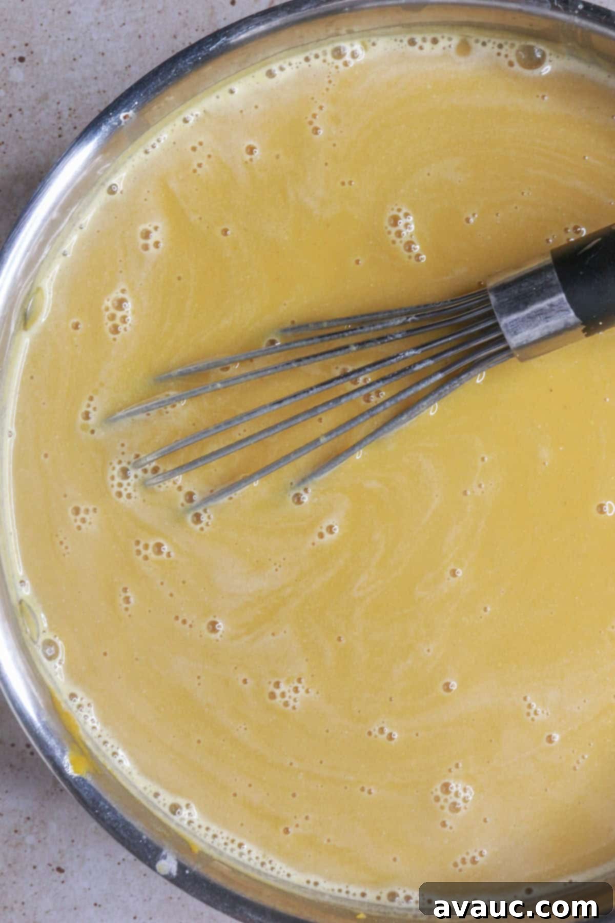 whisking pumpkin atole