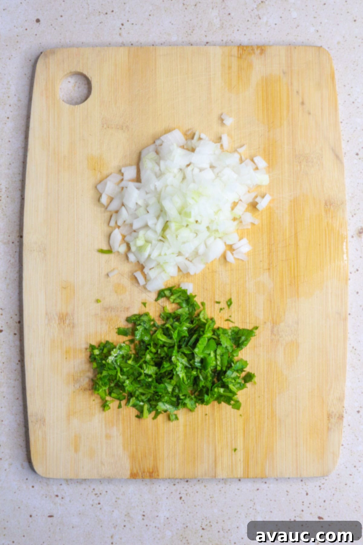 Chile de Arbol Salsa: A Fiery Tomato Delight 7 diced cilantro and onion on a wooden cutting board