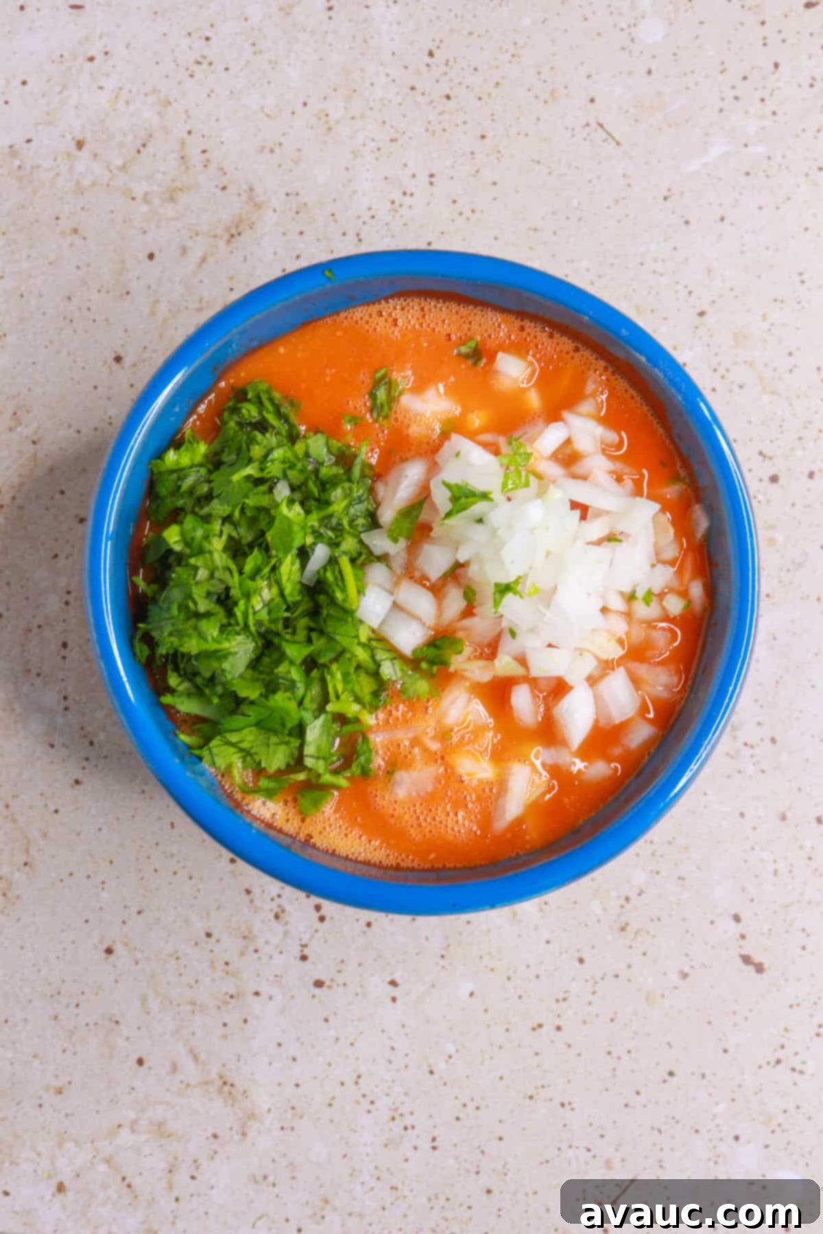 Chile de Arbol Salsa: A Fiery Tomato Delight 8 adding diced cilantro and onion to salsa