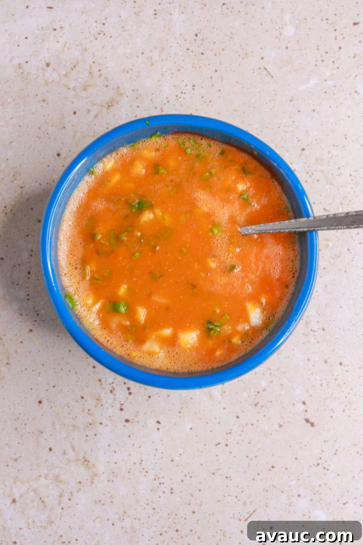 Chile de Arbol Salsa: A Fiery Tomato Delight 9 mixing chile de arbol salsa in salsa bowl